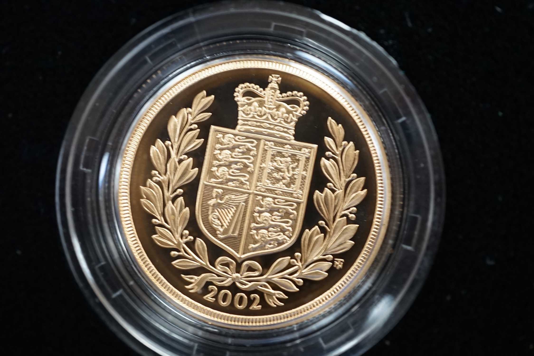 A cased 2002 United Kingdom gold proof sovereign three coin collection, with certificate.